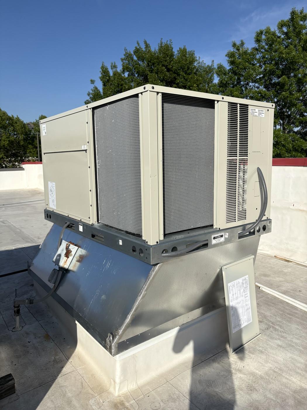 Rooftop packaged HVAC unit on a commercial building near Monroe NC