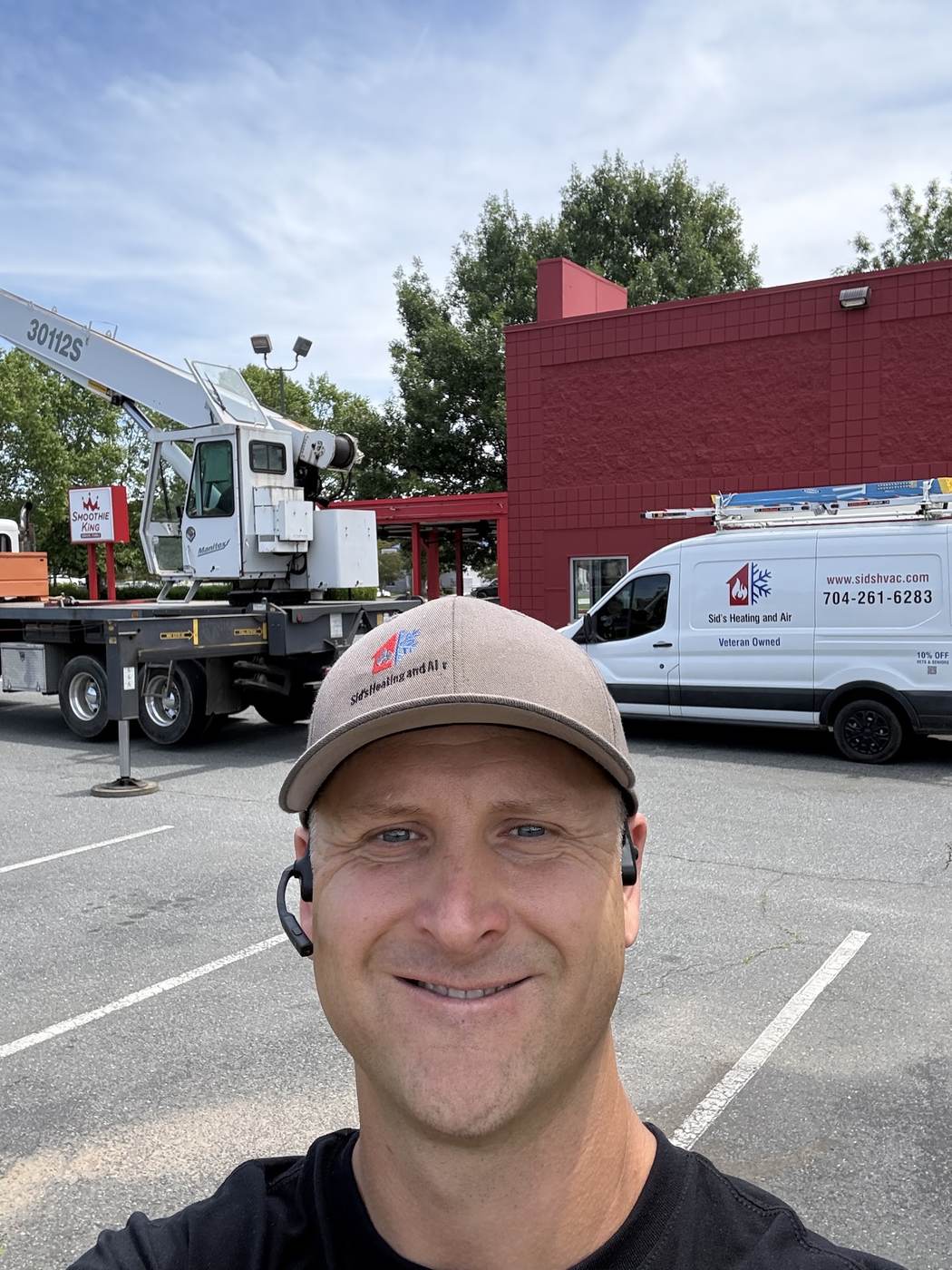 Sid's Heating and Air technician on a service call