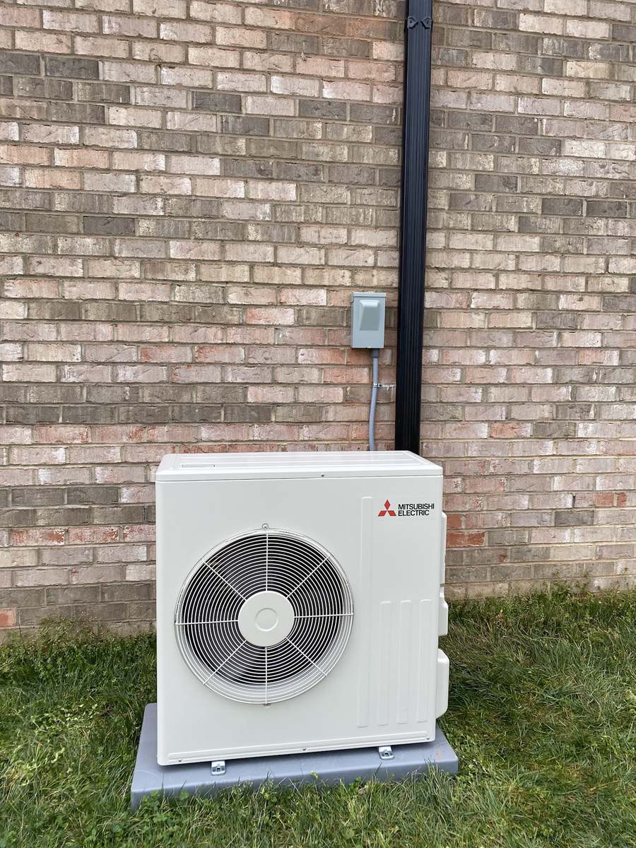 Ductless mini-split outdoor unit installed at a brick home in Union County NC
