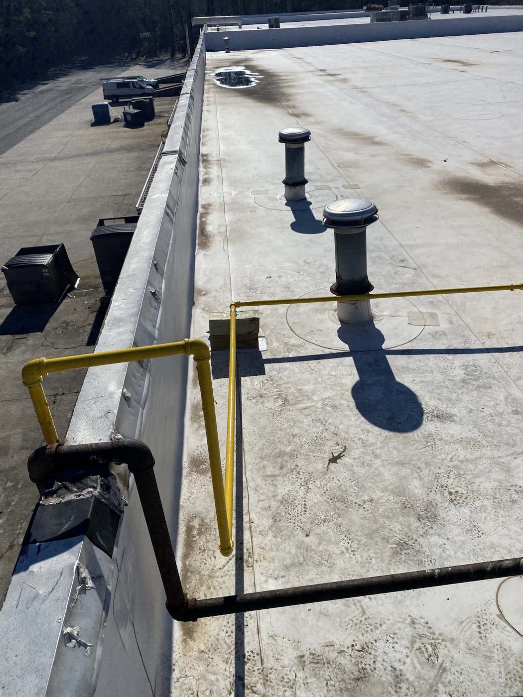 Gas piping run across a flat commercial roof