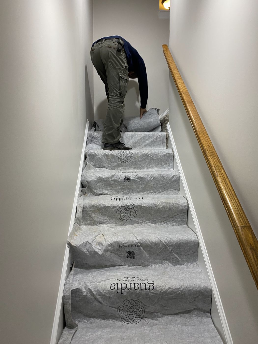 Floor protection laid down the stairs before work starts inside a customer's home