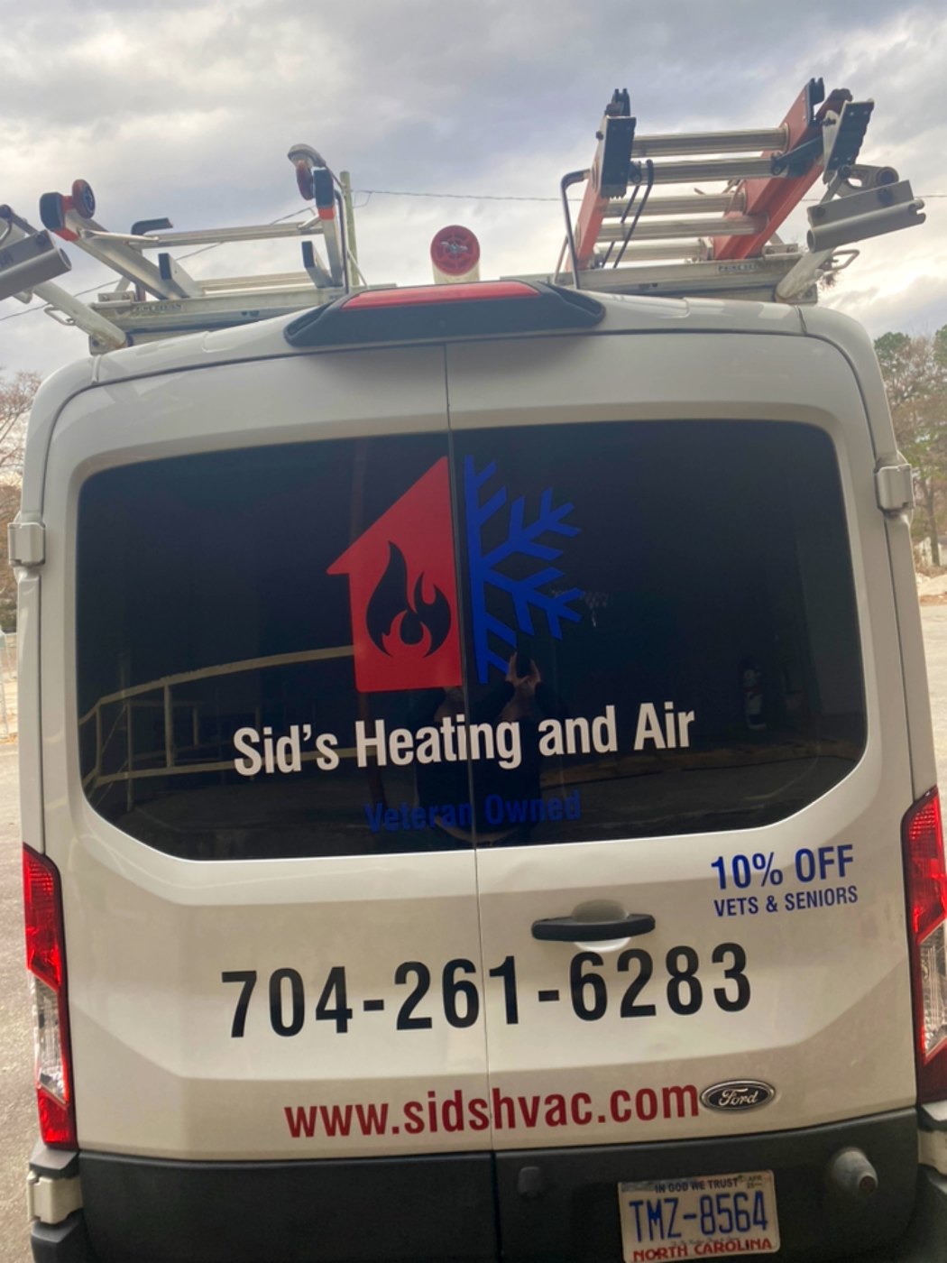 Service van rear showing the 10% veterans and seniors discount