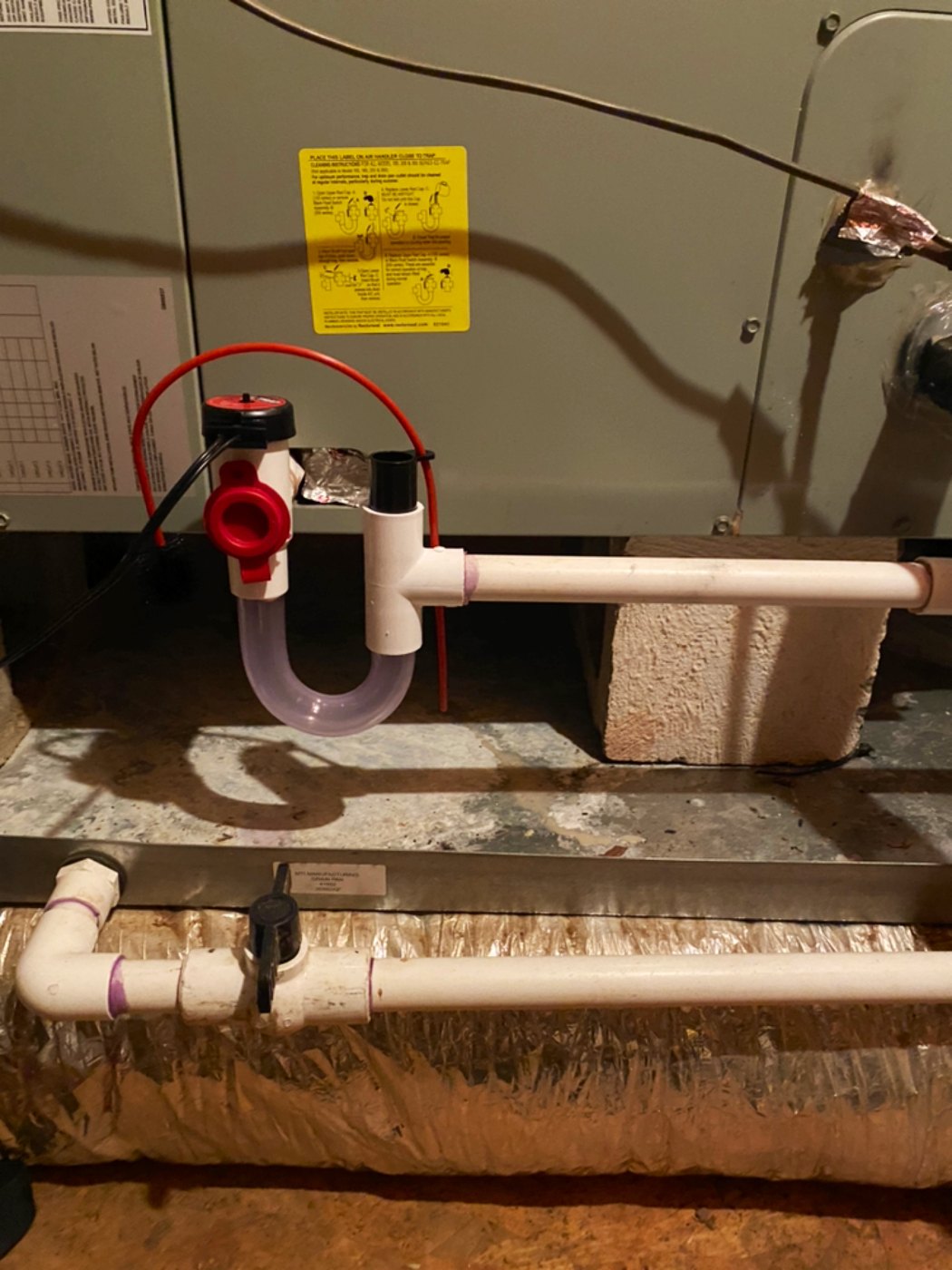 Condensate drain and service valve on a crawlspace air handler