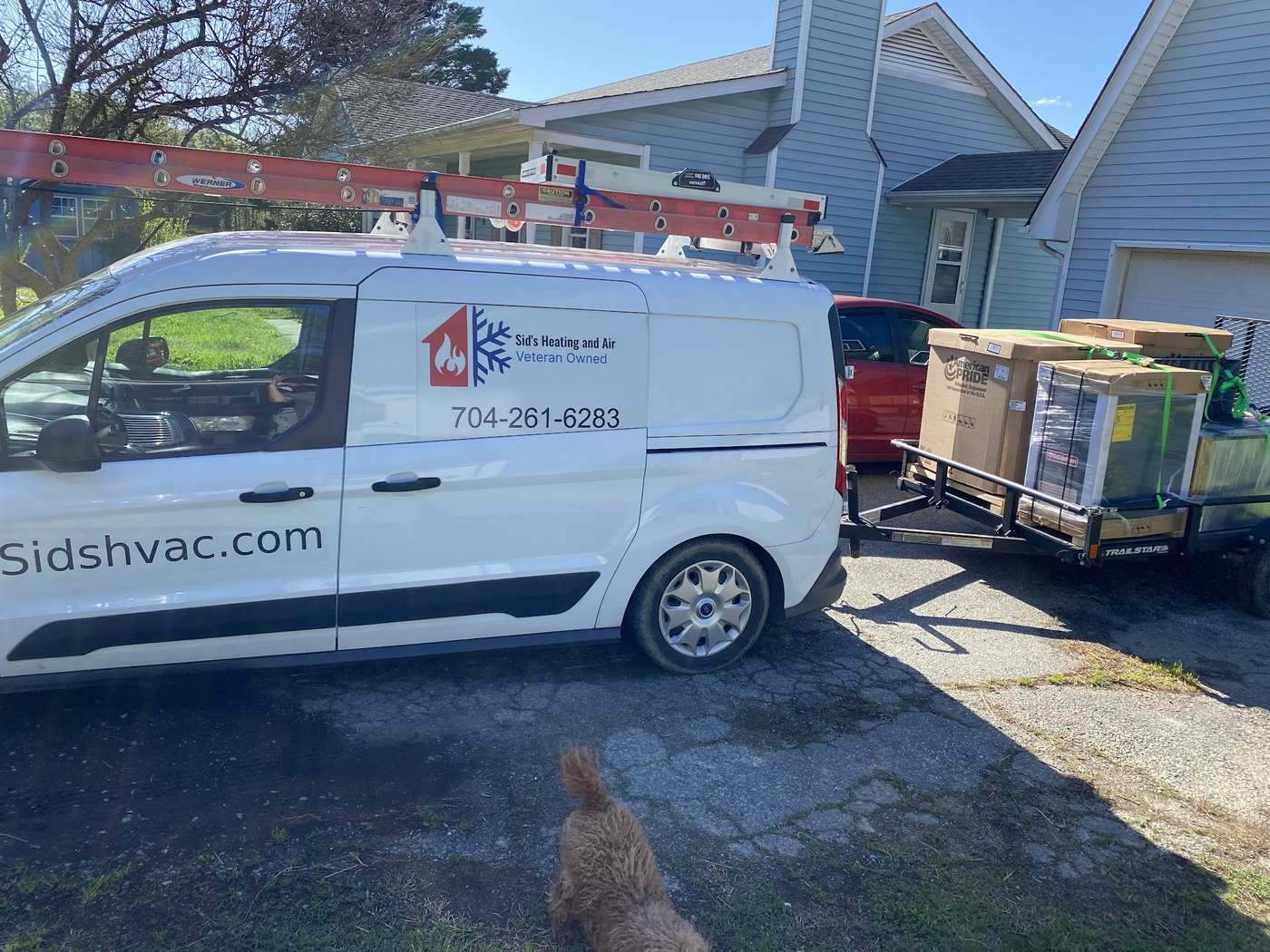 Service van and trailer loaded with equipment for an installation