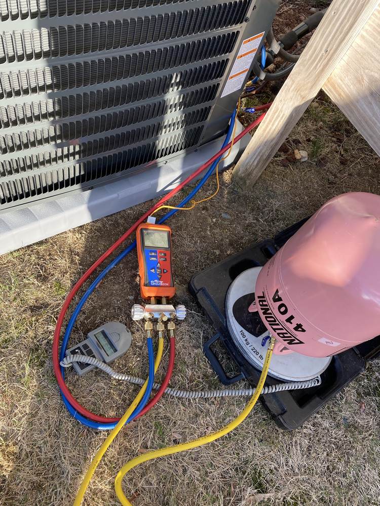 Manifold gauges connected at an outdoor unit