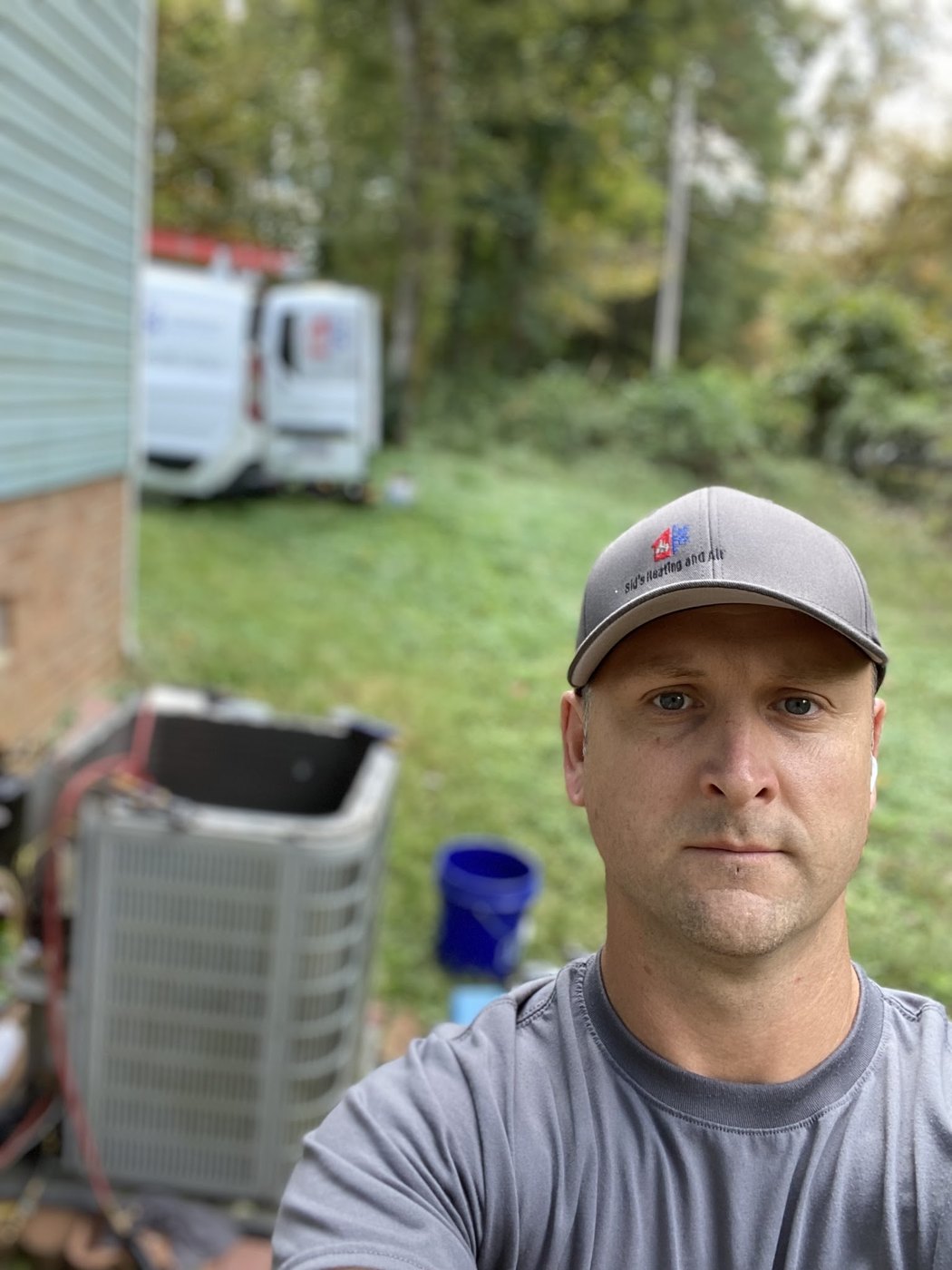 Sid's Heating and Air technician on a residential service call