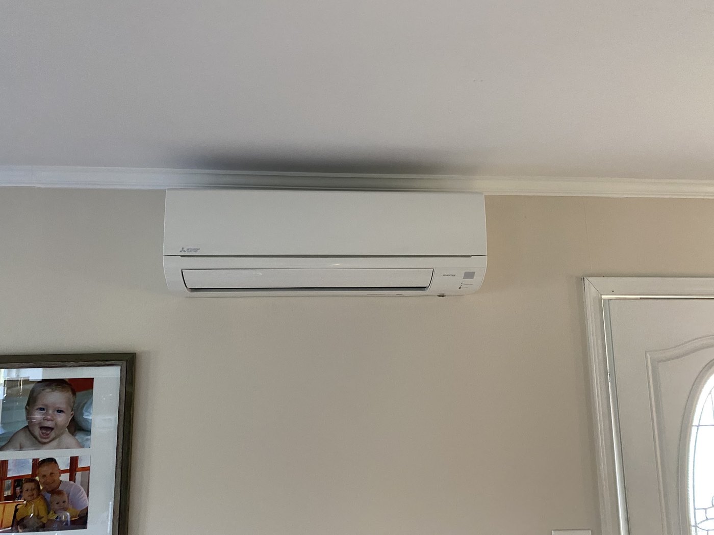 Ductless mini-split head mounted in a living space