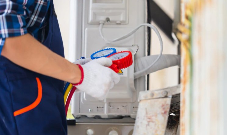 Ductless mini-split head being cleaned during service