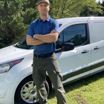 Sid's Heating and Air technician with the service van