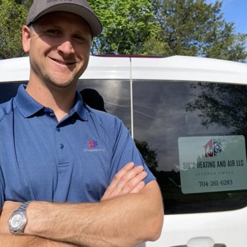 Sid's Heating and Air technician with the company van